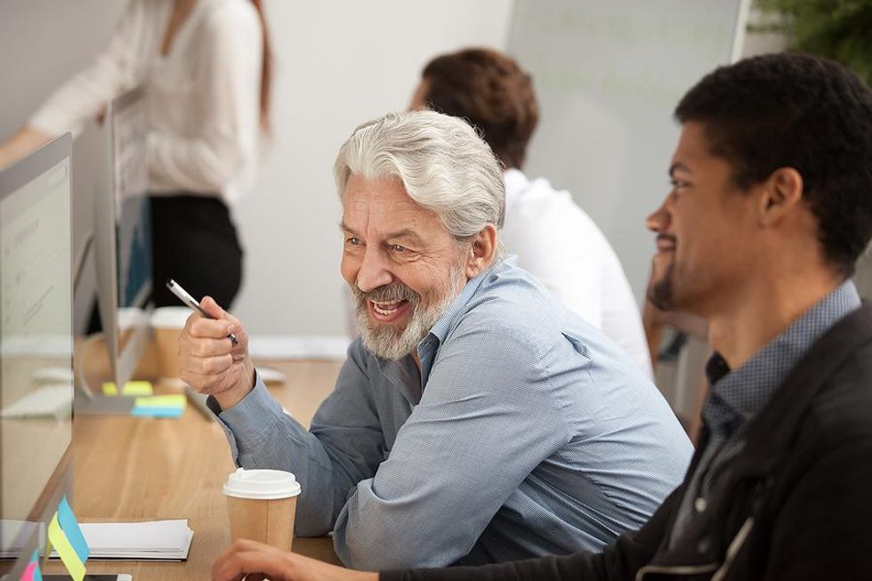 Male leader talks to a colleague