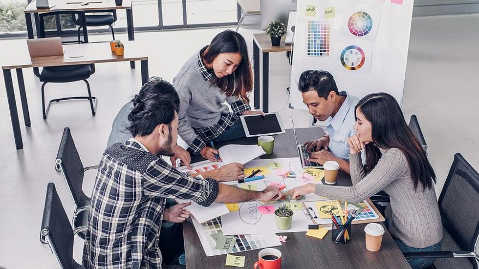 Female leader works with her colleagues