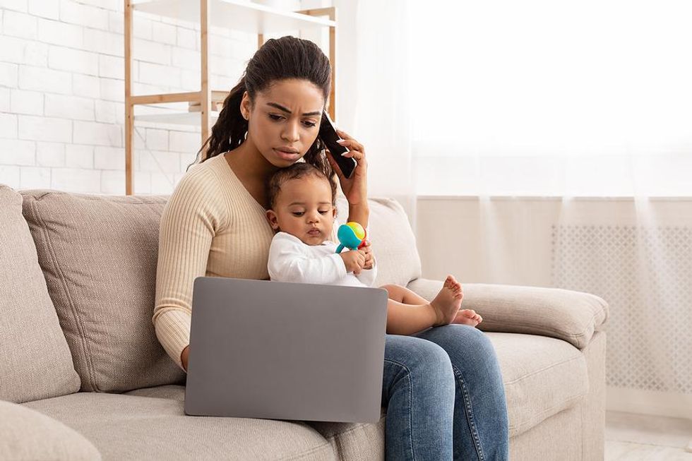 Working mom on the phone for her low-stress remote job