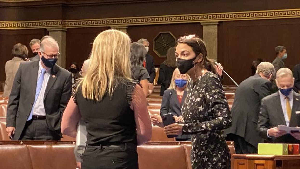 Rep. Marjorie Taylor Greene confronting Rep. Alexandria Ocasio-Cortez on the House floor on April 21, 2021.