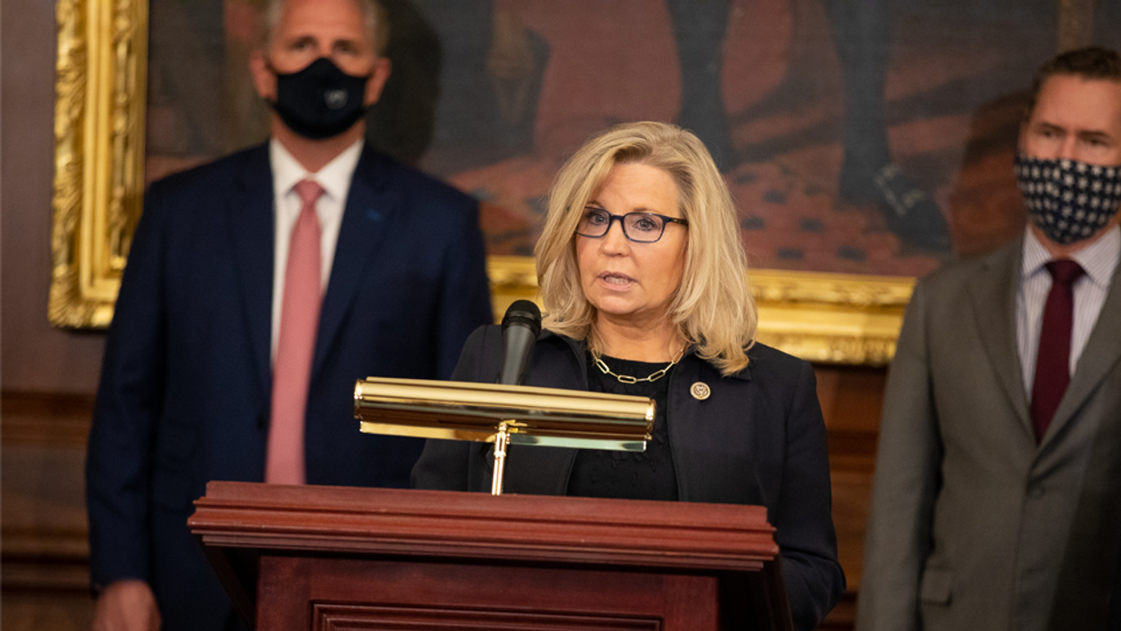 Rep. Liz Cheney speaking with House Minority Leader Kevin McCarthy in the background.