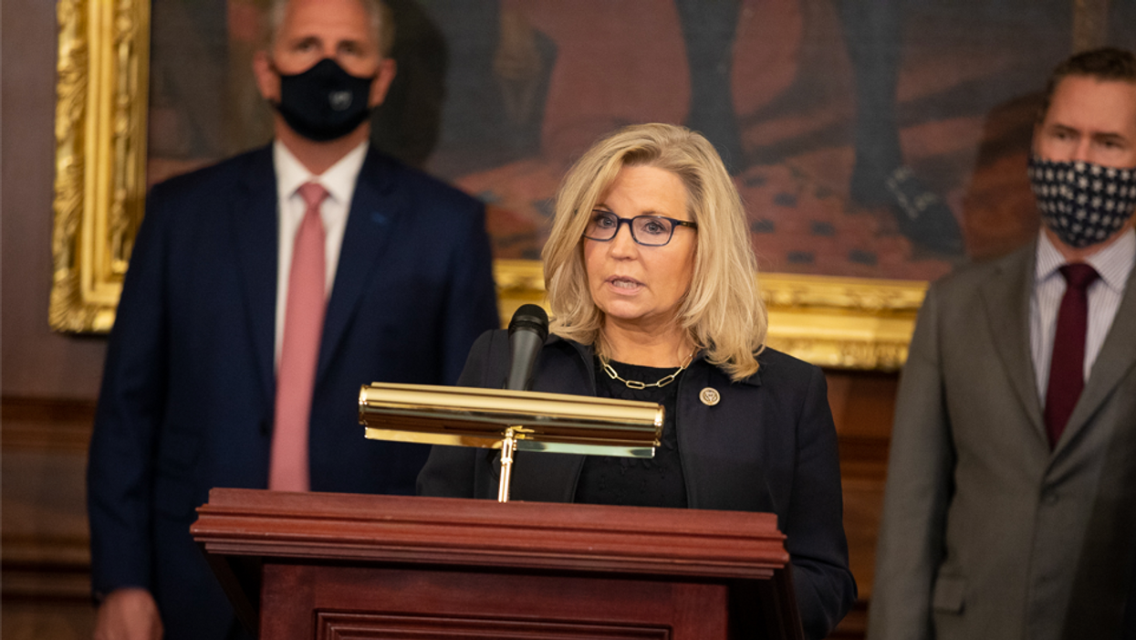 Rep. Liz Cheney speaking with House Minority Leader Kevin McCarthy in the background. 