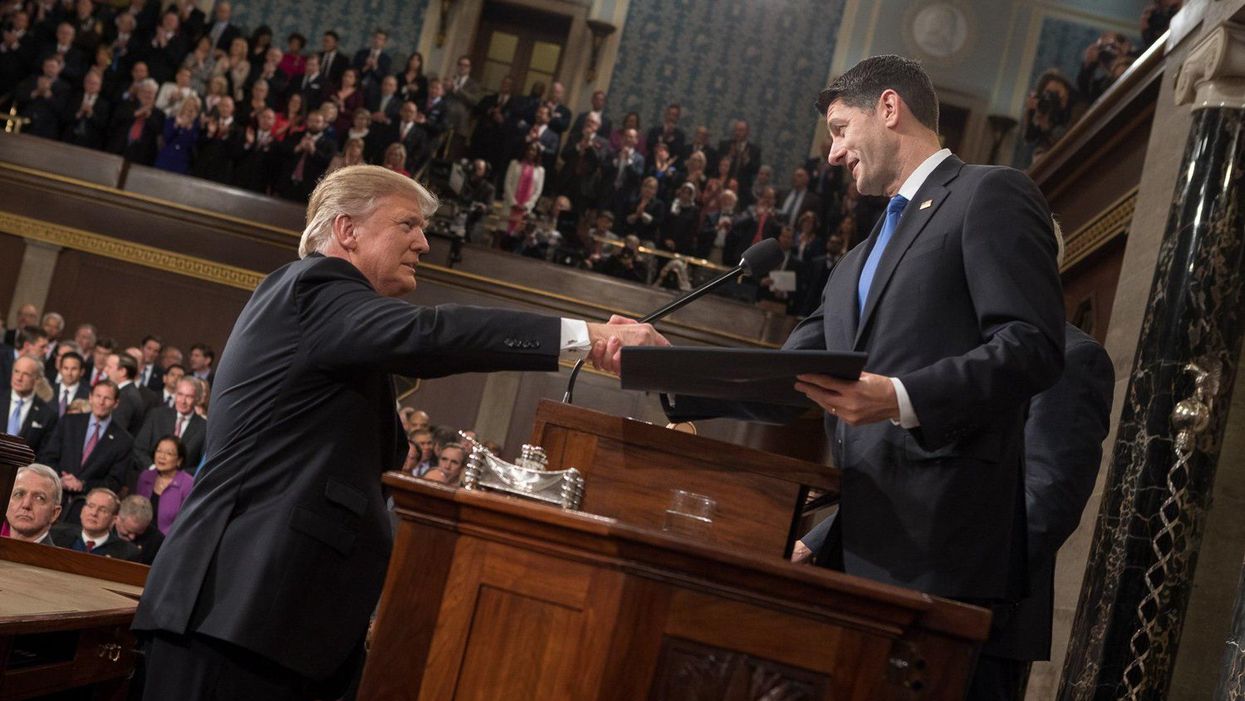 Former President Trump, left, shaking hands with former House Speaker Paul Ryan. 
