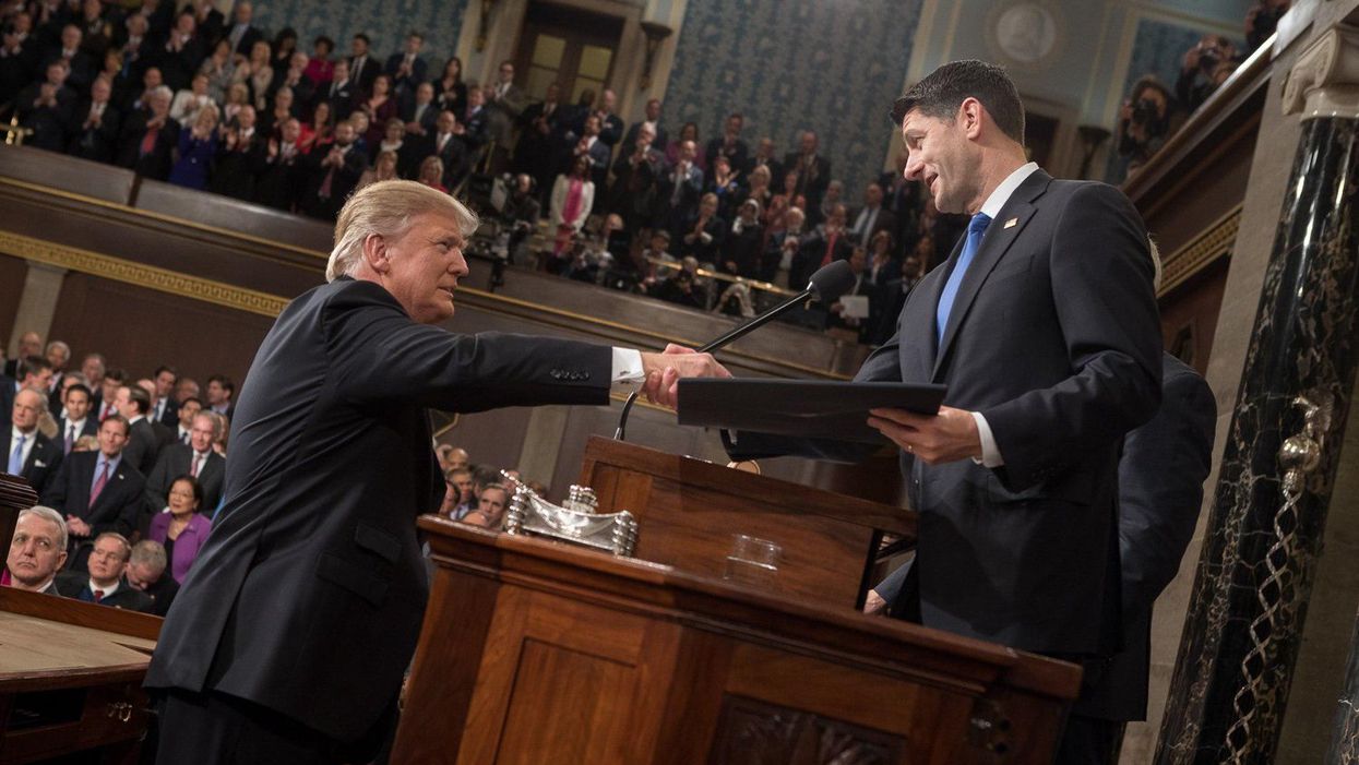 Former President Trump, left, shaking hands with former House Speaker Paul Ryan.
