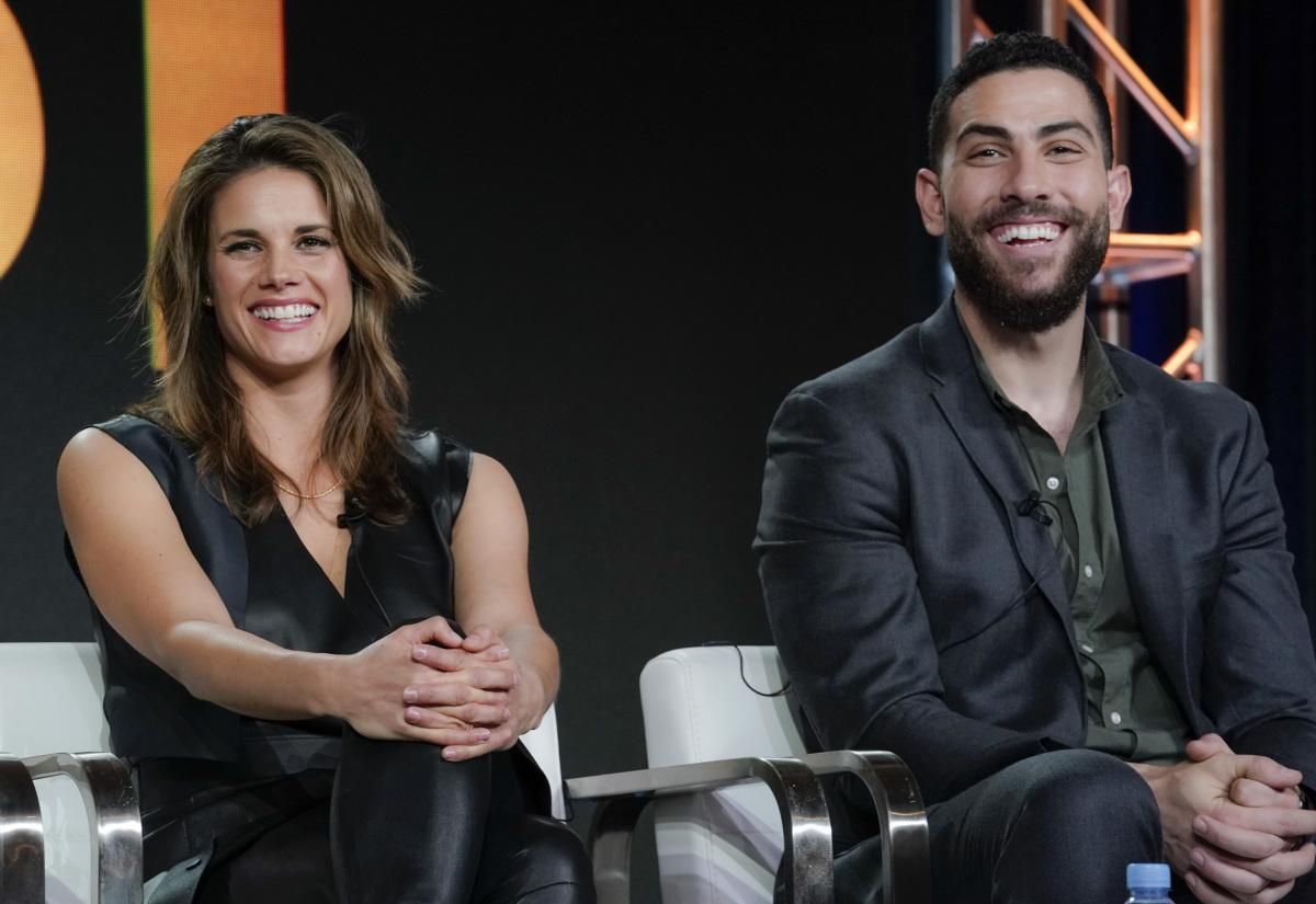 Missy Peregrym and Zeeko Zaki sitting onstage at a panel discussion