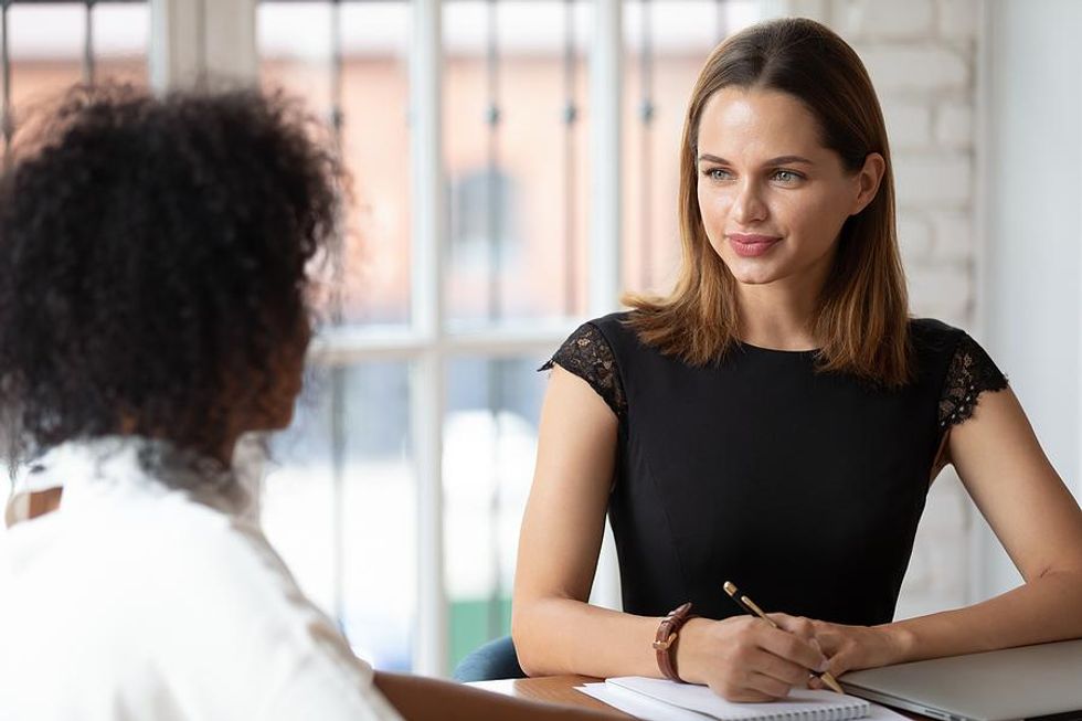Hiring manager listens to a job candidate during an interview