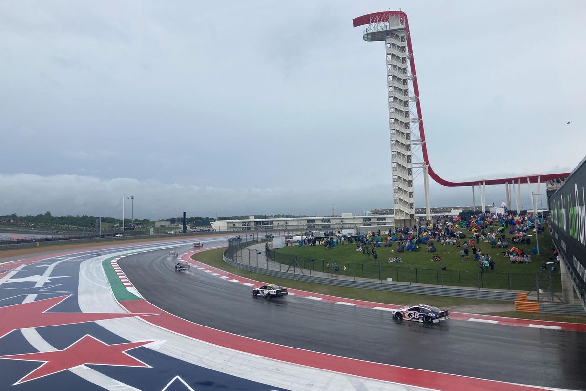 Rain on the track mars a true finish, but thousands still show to Austin's first NASCAR race