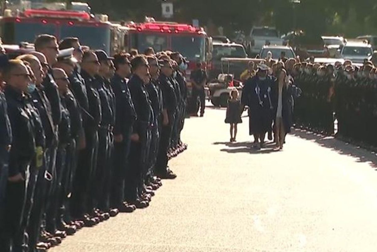 Two days after a firefighter's death, hundreds of colleagues attended his daughter's graduation