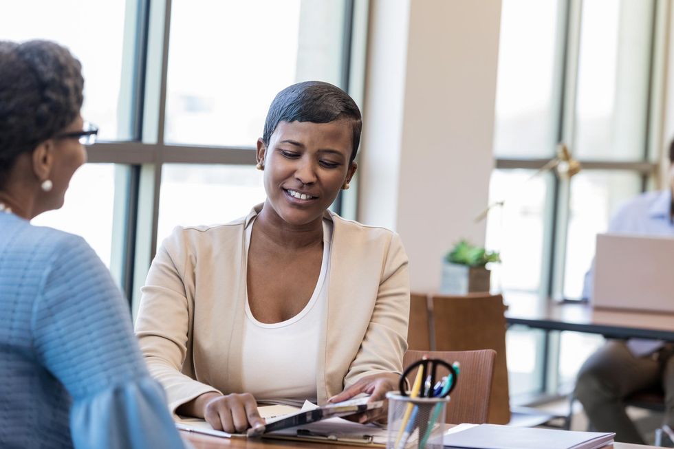 black-woman-talking-bank-employee