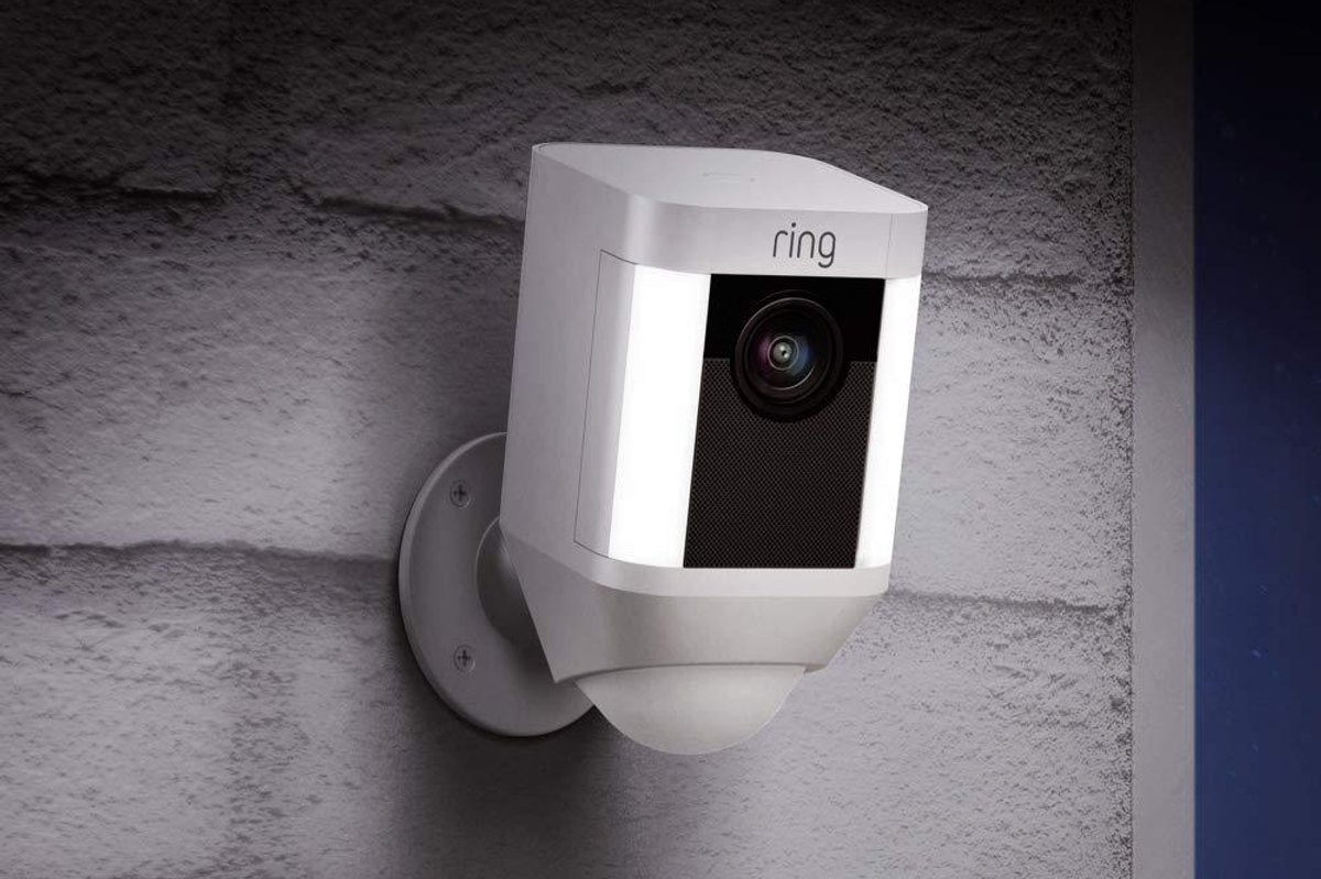 Ring Spotlight Cam Battery HD Secuity Camera on a wall.