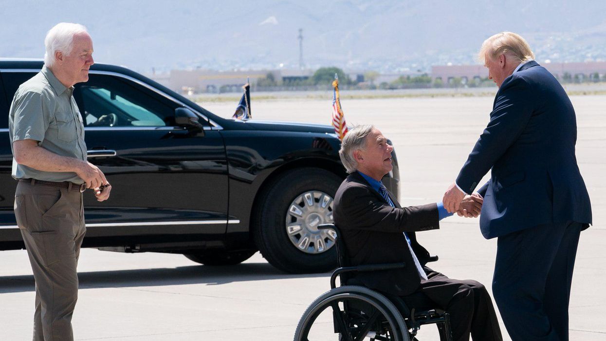 Texas Gov. Greg Abbott, center, shaking hands with former President Trump in El Paso, TX.