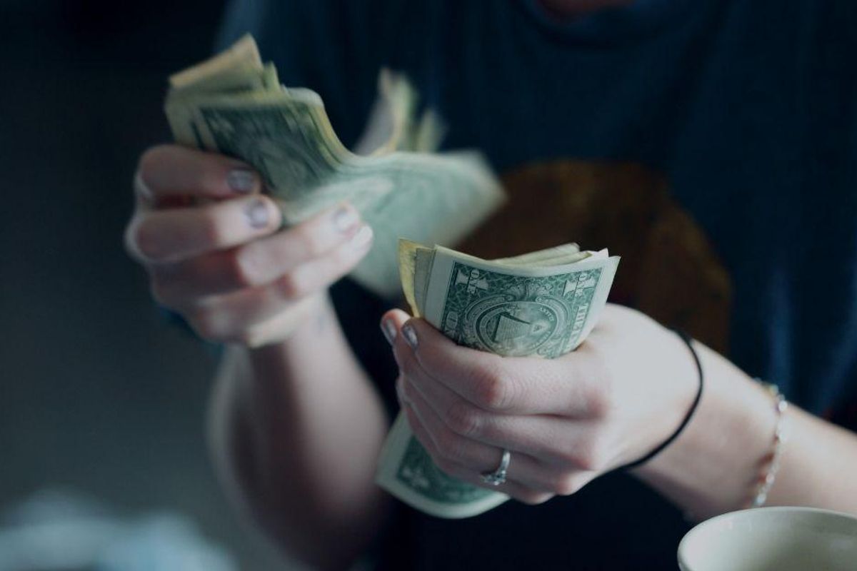 A controversial post about couples splitting travel costs has folks debating love and money