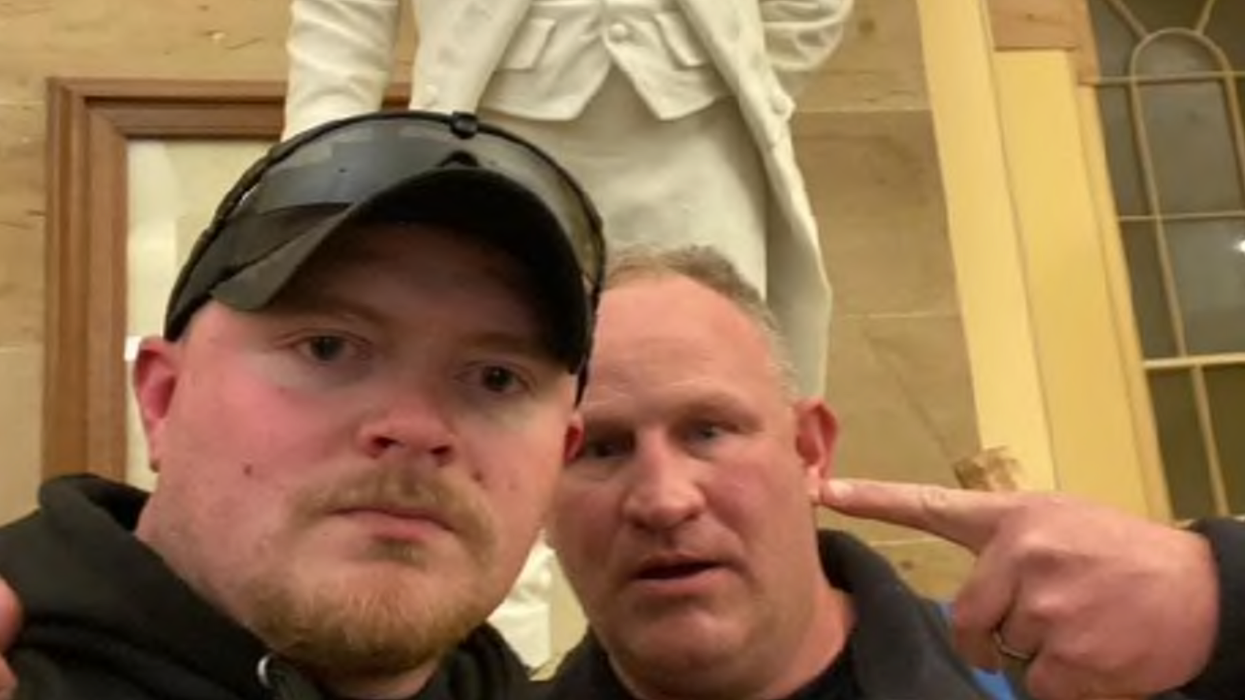 Thomas Robertson, right, and Jacob Fracker during the January 6, 2021 Capitol insurrection.