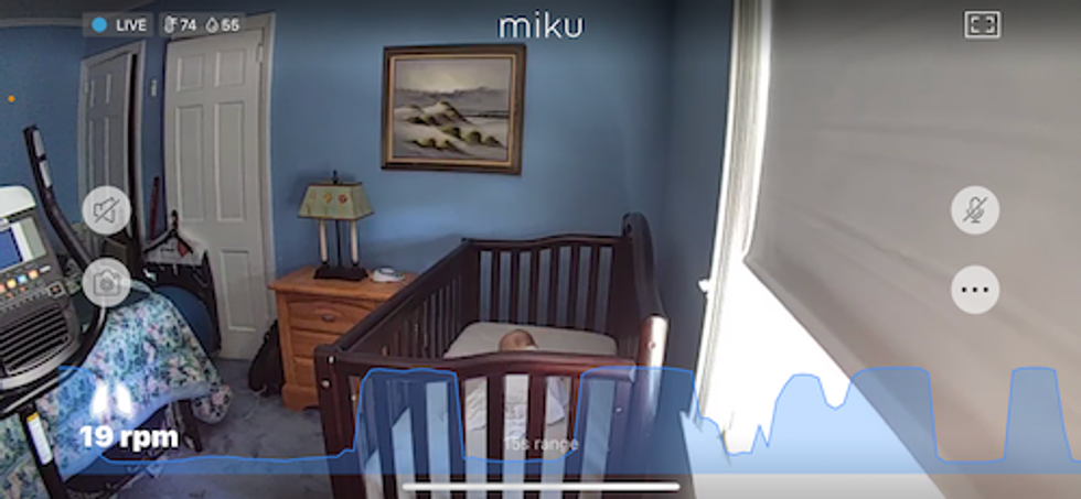 Miku App showing baby sleeping and live breathing scrolling at the bottom of the screen.