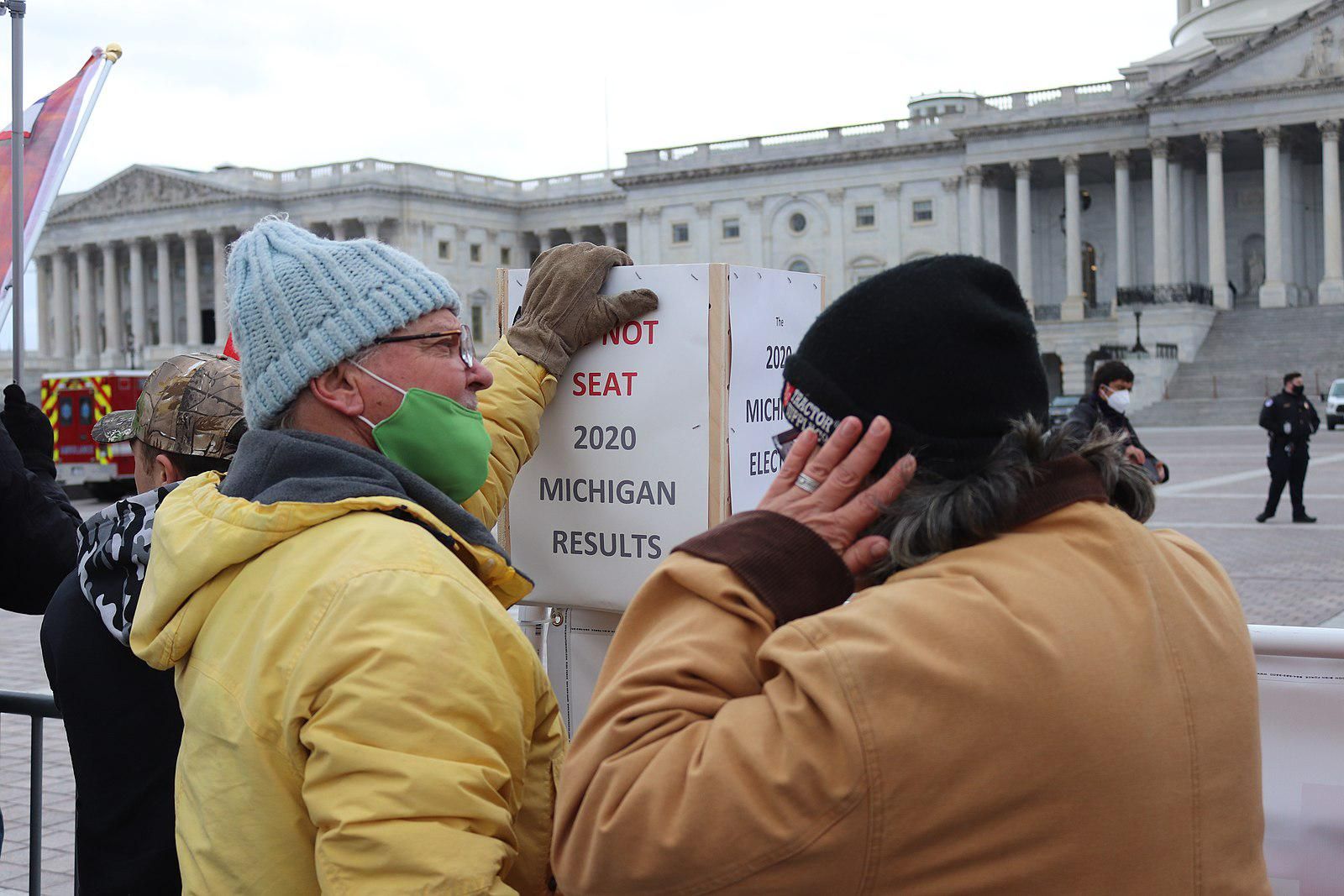 Man protests Michigan's election results on the day of the January 6 Capitol insurrection. 