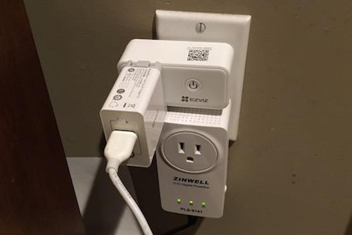 EZVIZ T30 Smart Plug in a wall outlet.