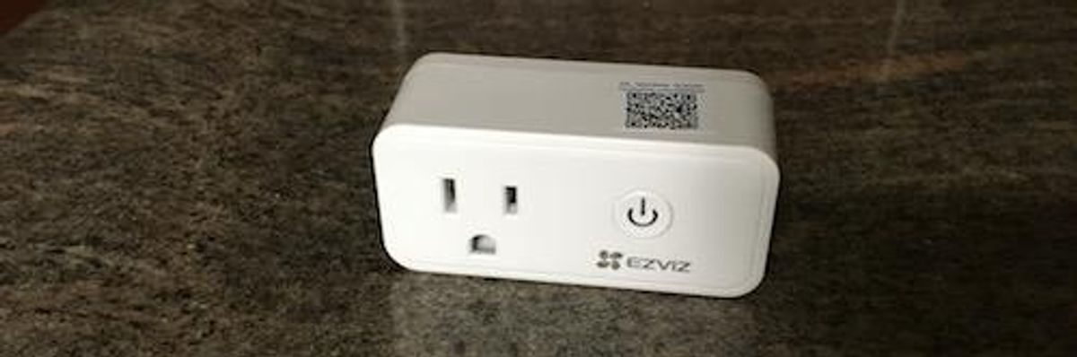 Front side of EZVIZ Smart Plug on a countertop[