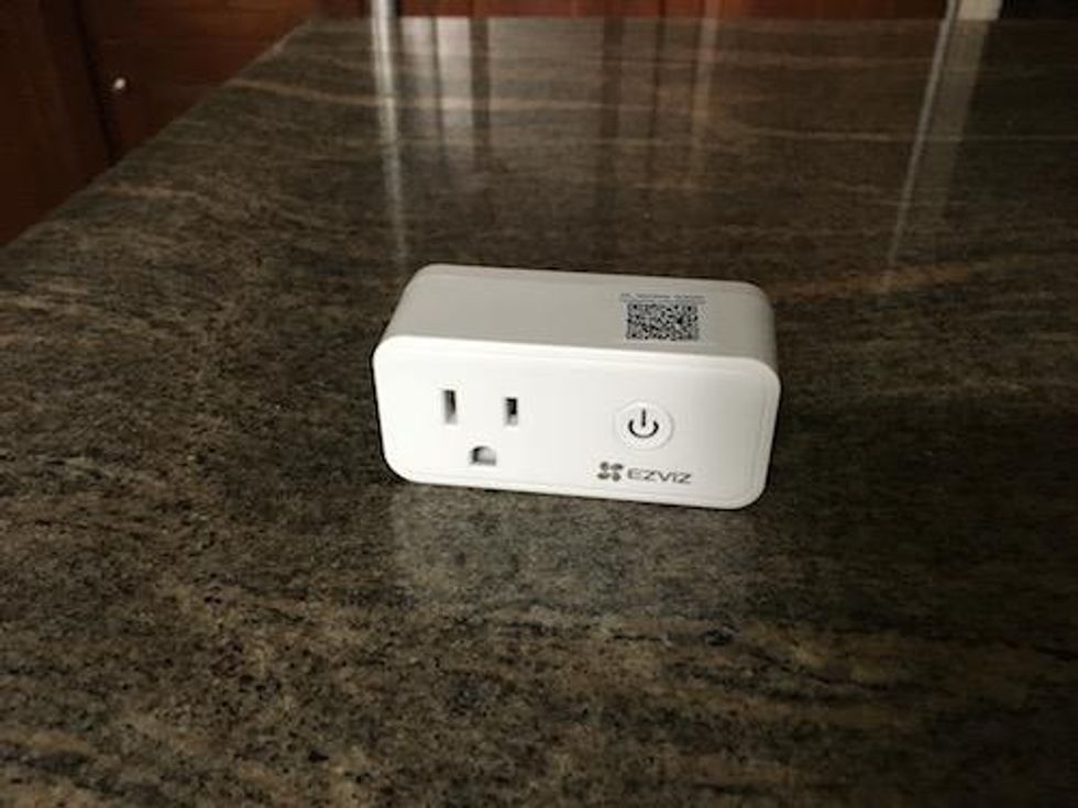 Front side of EZVIZ Smart Plug on a countertop[