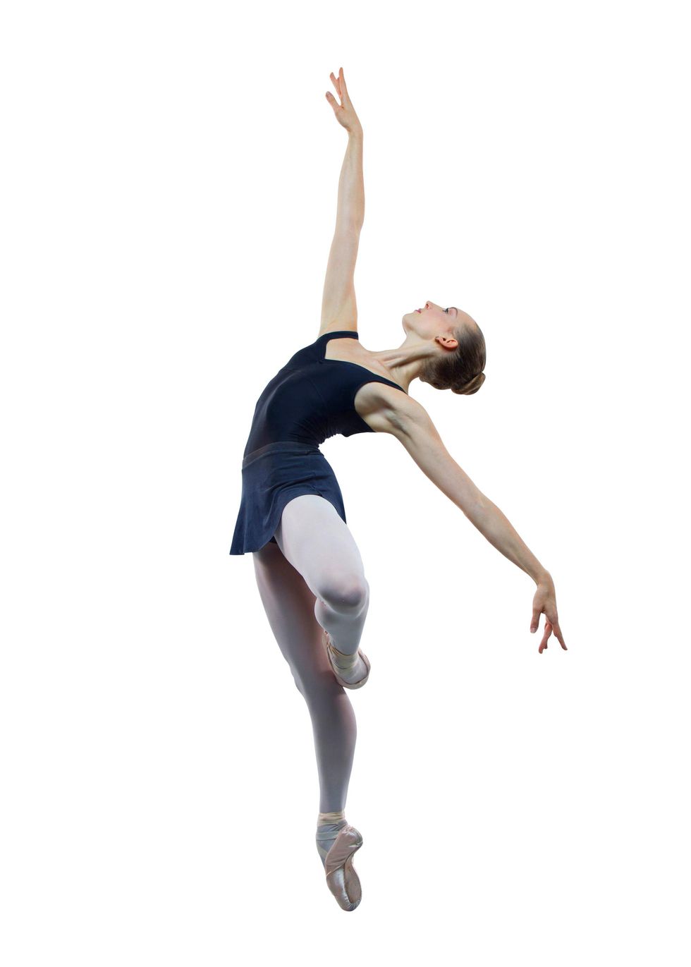 Sydney Ransbury is shown in profile on pointe with her left leg in pass\u00e9, arching her upper body back with her right arm reaching high and her left arm extended down and to the side. She wears a black leotard, black skirt, pink tights and pointe shoes.