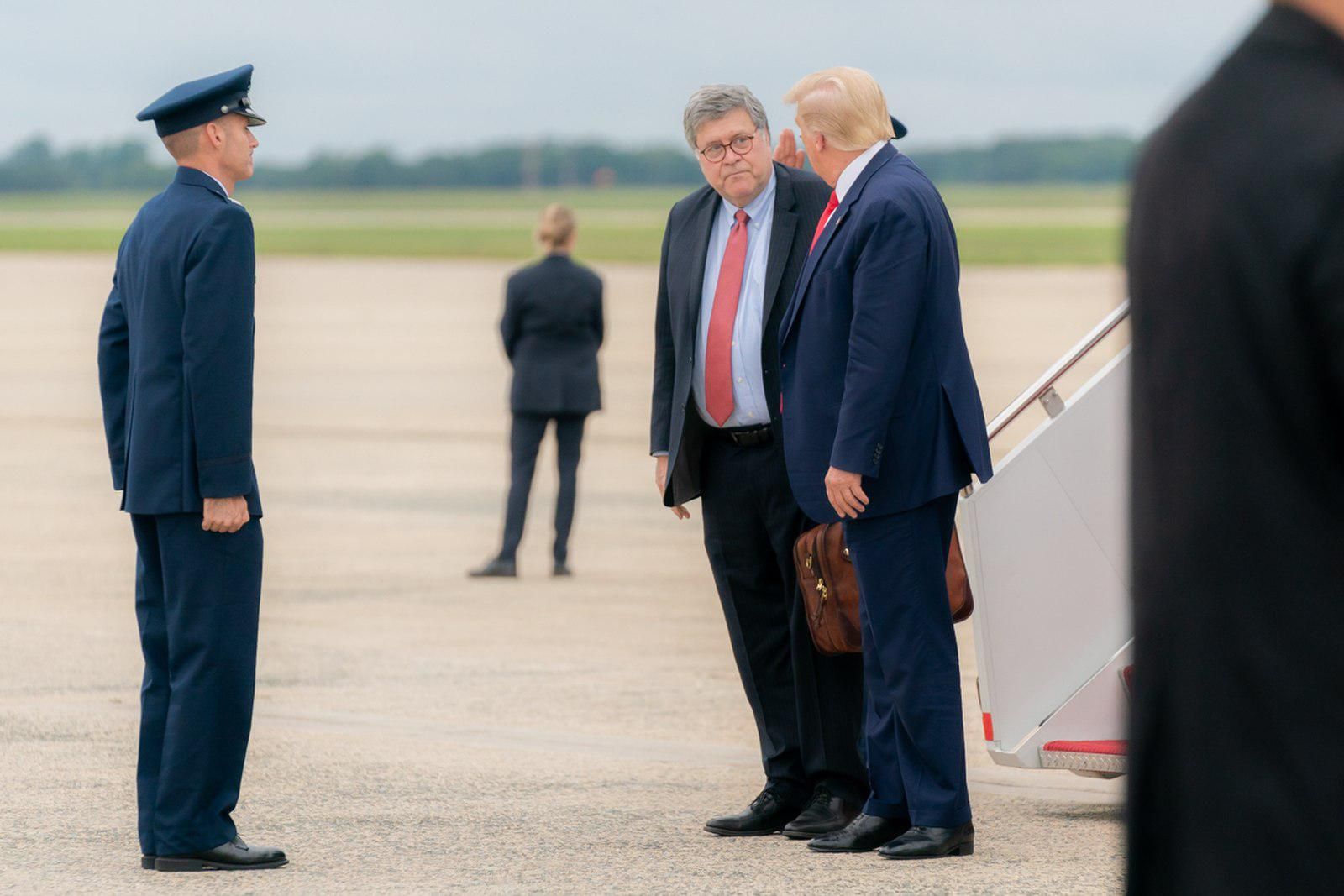 Former Attorney General William Barr, left, and former President Trump. 