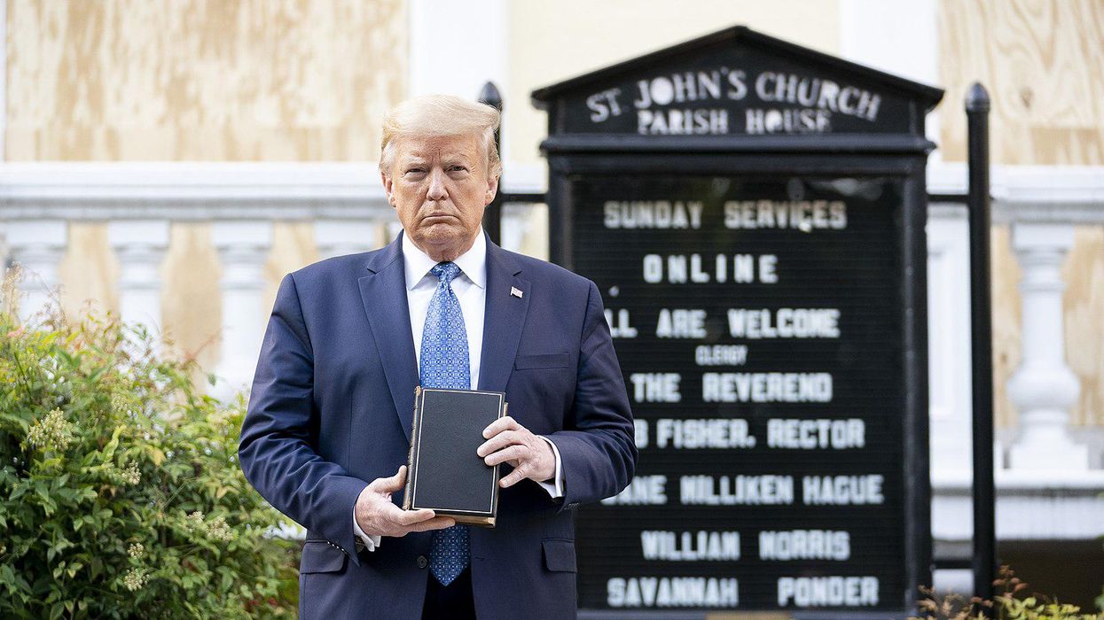 Former President Trump posing with a Bible in front of St. John’s Episcopal Church.