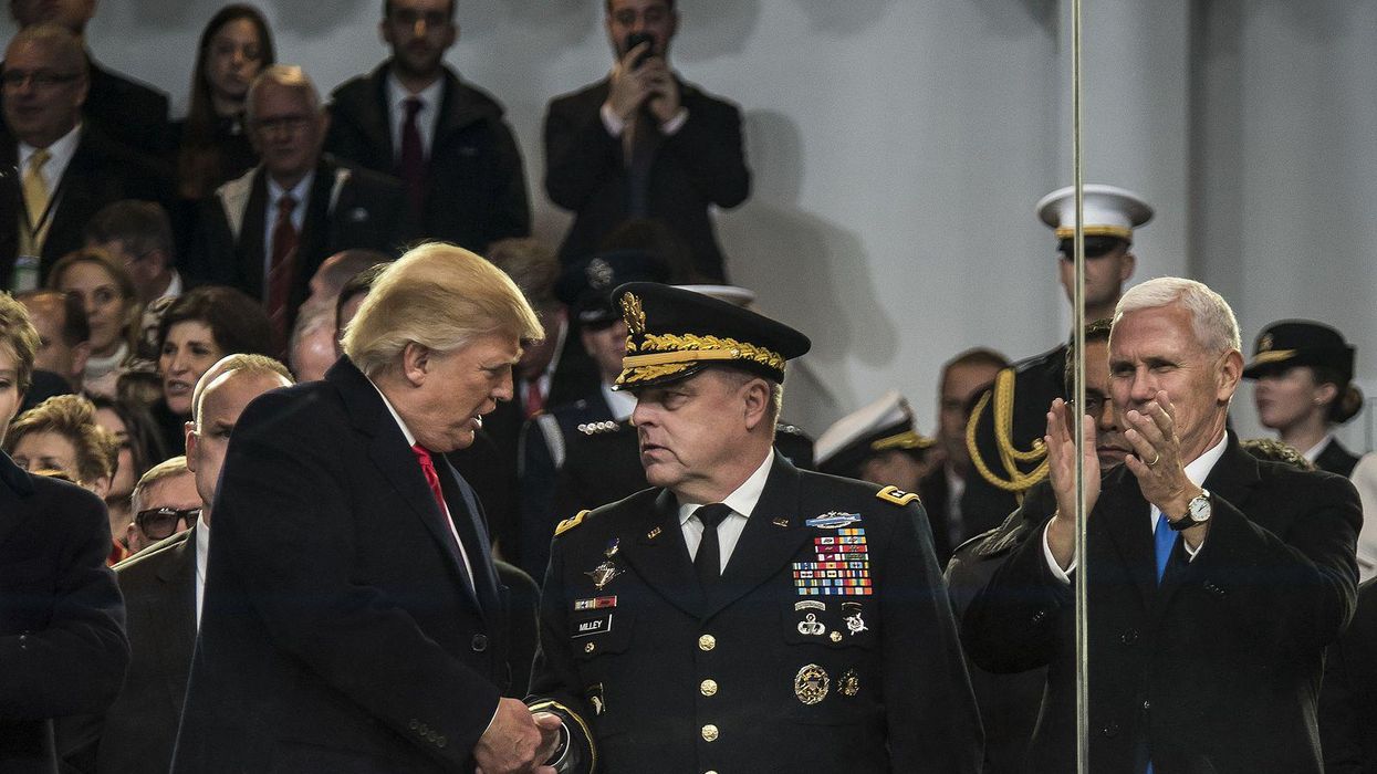 Former President Trump, left, shaking hands with General Mark Milley.