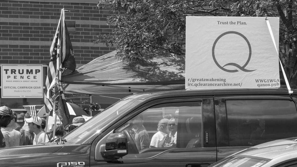 A sign promotes Qanon at a Trump rally.