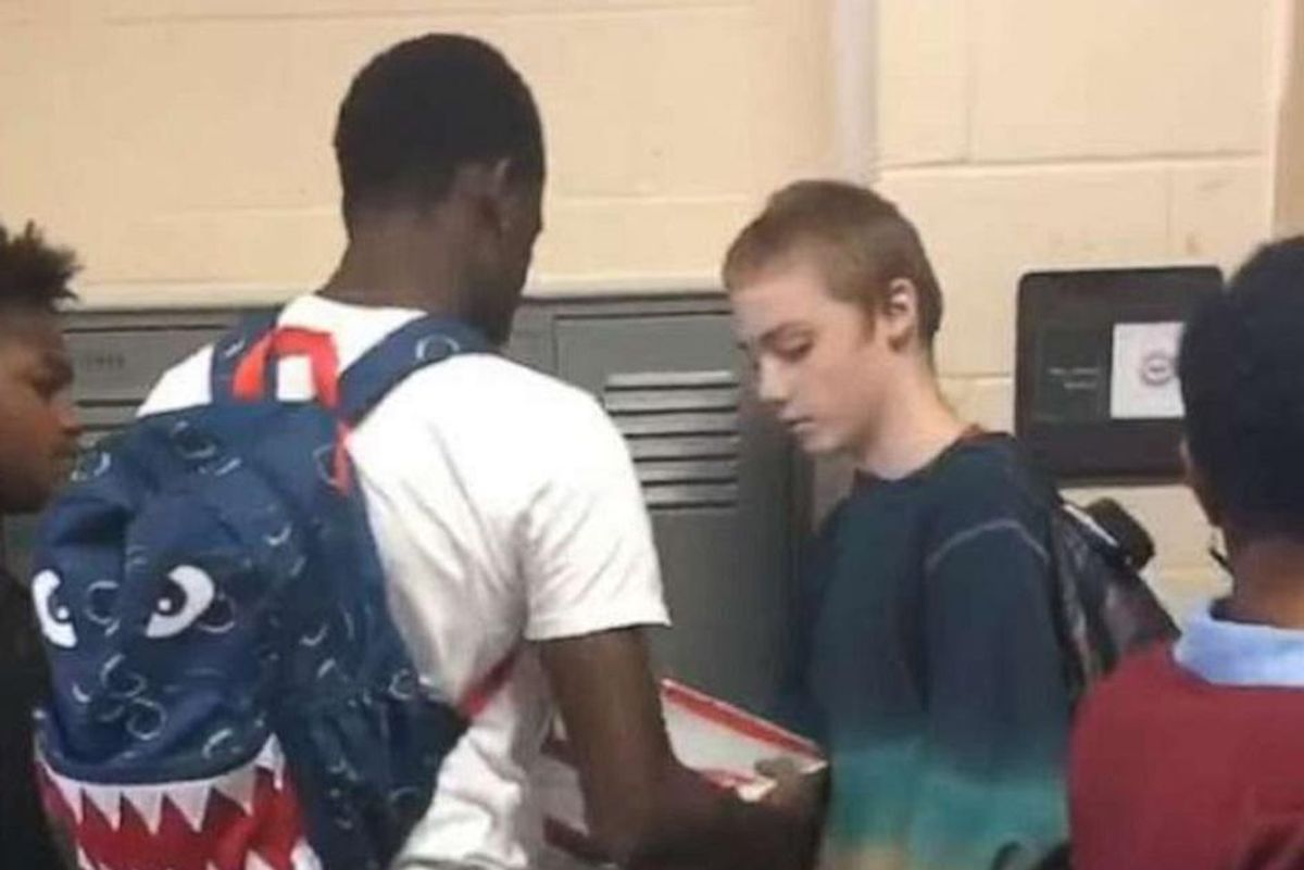 High schooler mocked for wearing the same clothes every day surprised by football players