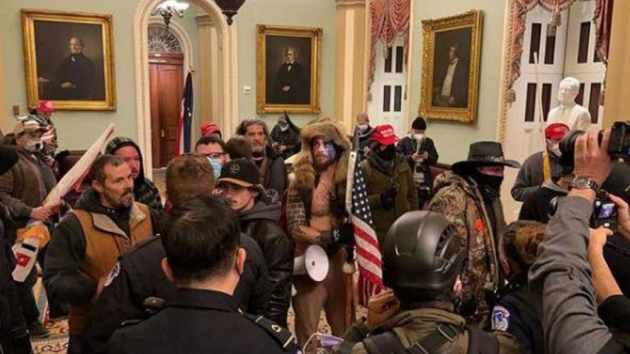 Jacob Chansley, or the "QAnon Shaman," during the January 6 Capitol riot. 