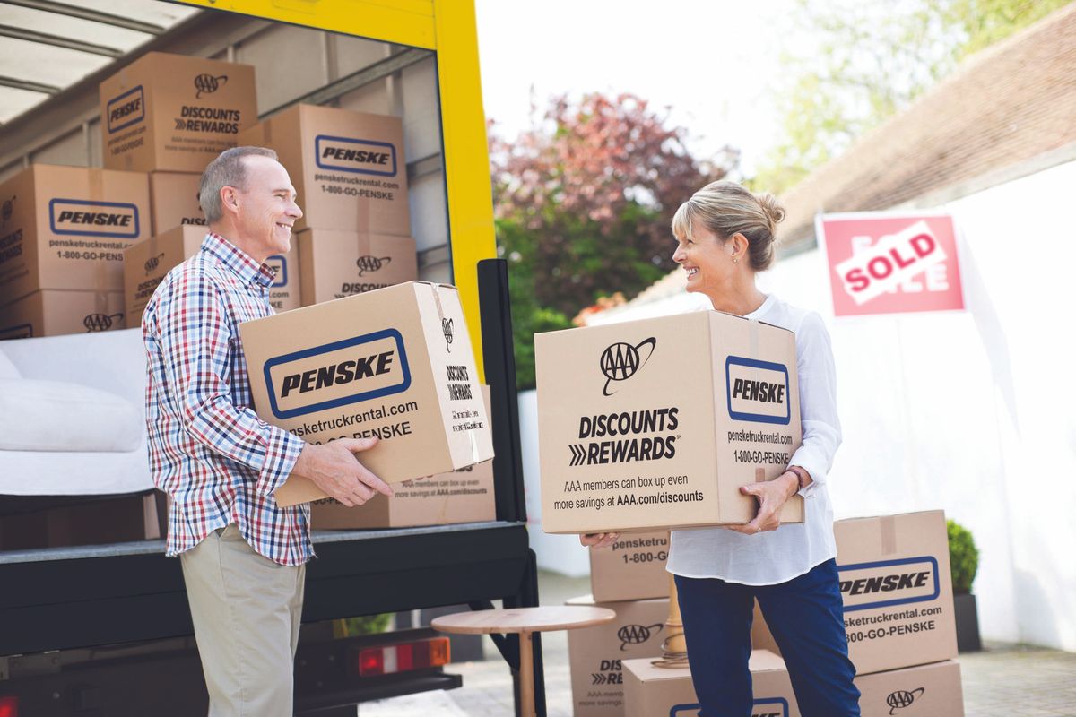 Couple unloading Penske truck