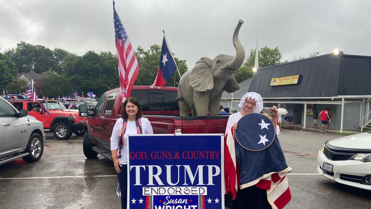 Susan Wright, left, poses next to a "Trump endorsed" campaign sign.