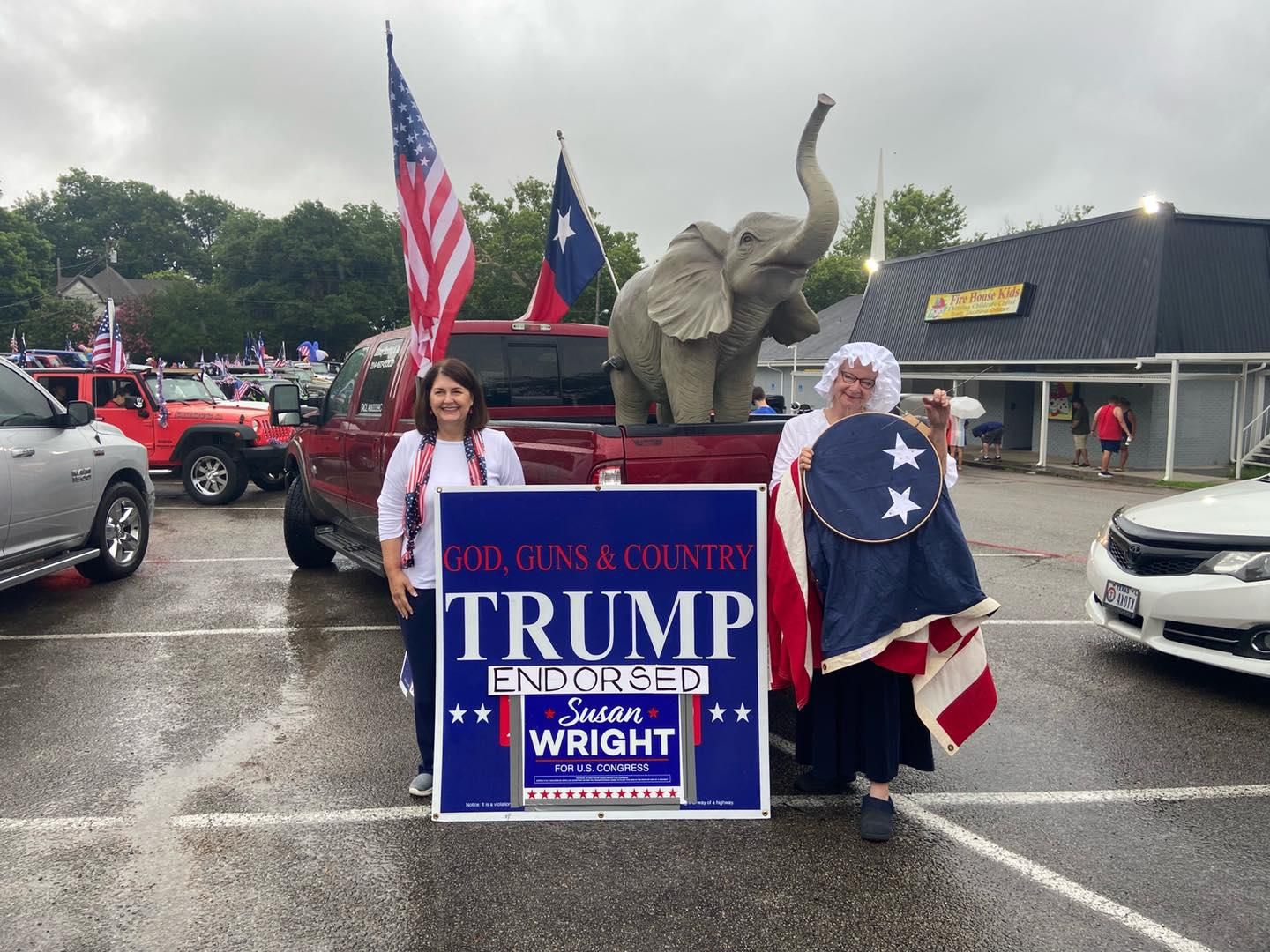 Susan Wright, left, poses next to a "Trump endorsed" campaign sign.