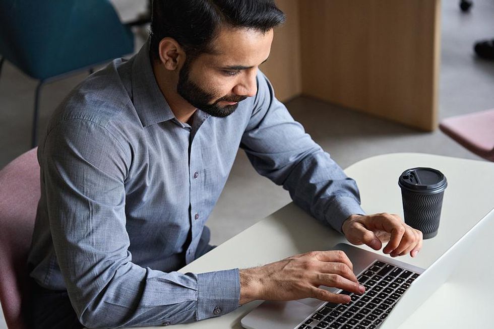 Man manages his time while working and going to school