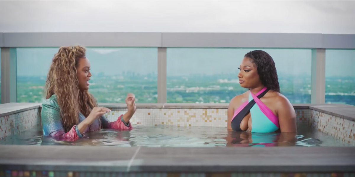 Not Tyra Banks Wearing a Maxi Dress in a Hot Tub