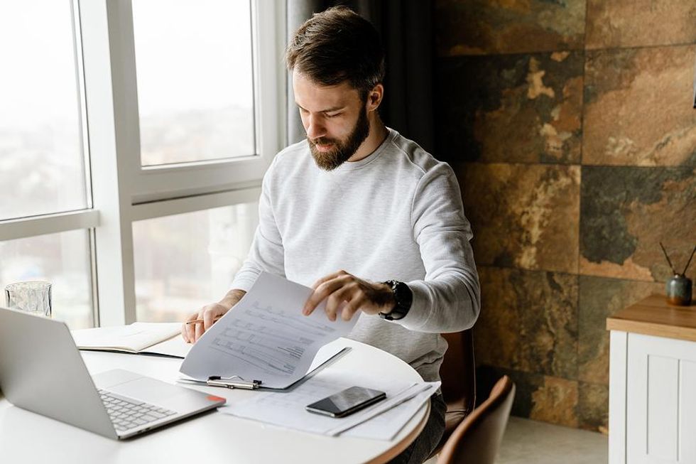 Man looks at bullet points on his resume