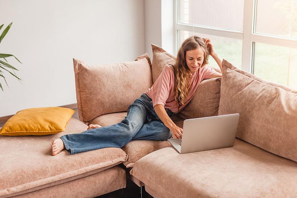 Woman writes bullet points on her resume