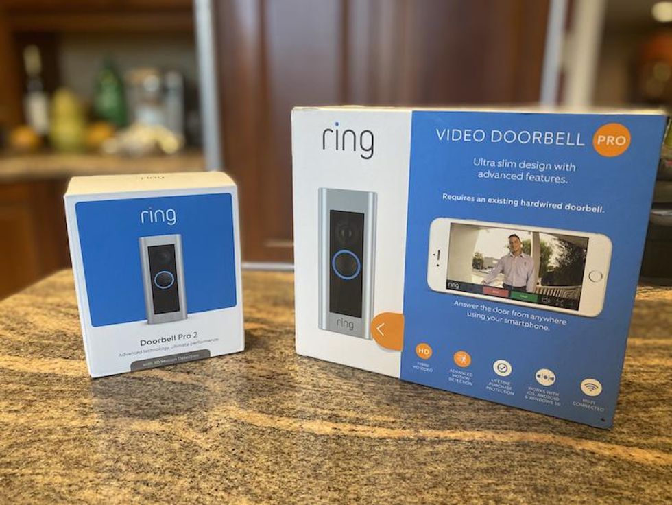 Ring Video Doorbell Pro 2 and Pro boxed on a countertop
