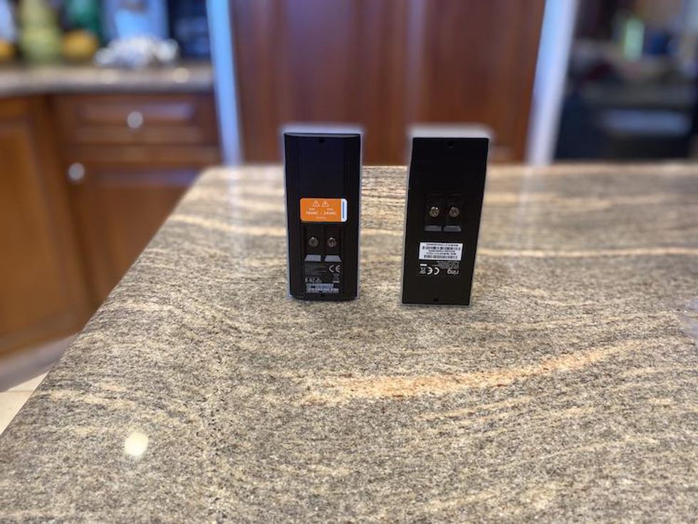 Backside view of Ring Video Doorbell Pro 2 and Pro on a countertop
