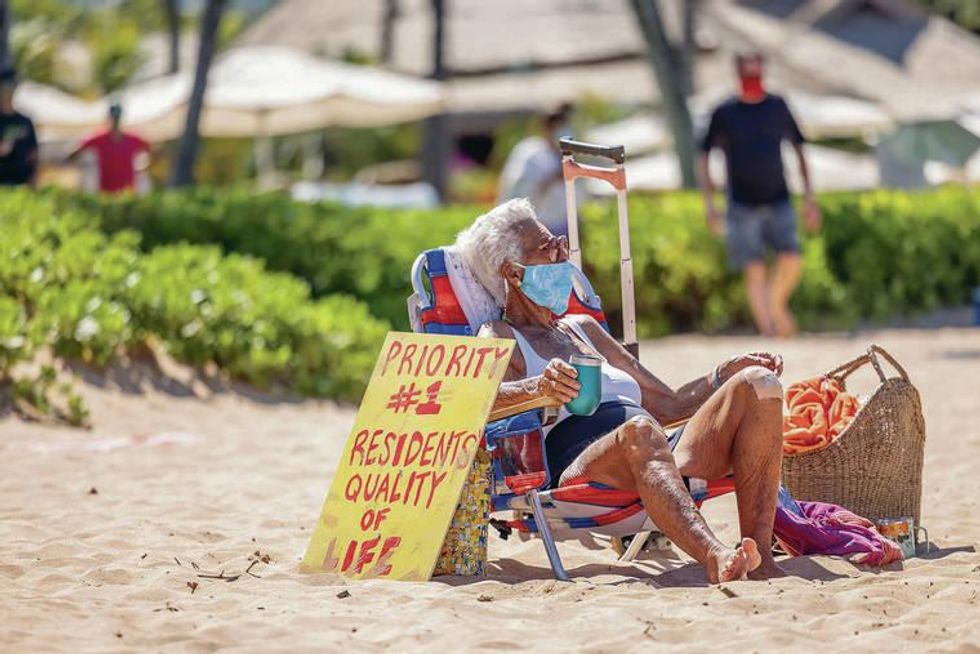 A Hawaii resident protests over tourism