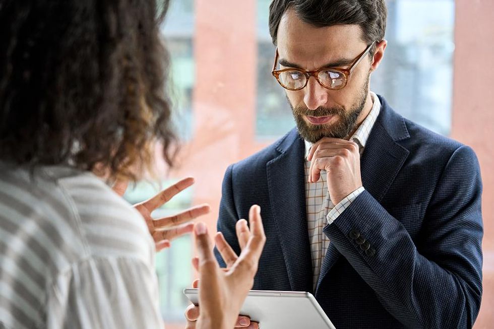 Woman talks to her boss about stress