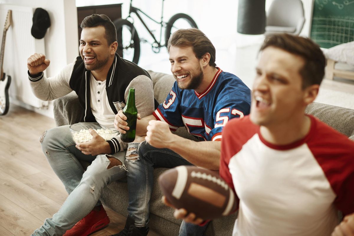 group of men watching a game