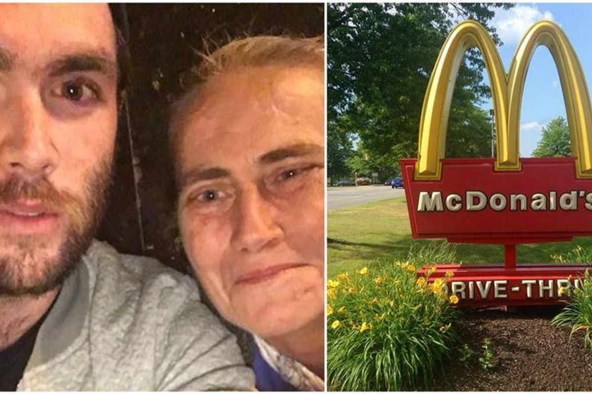 man and woman take photo; a McDonald's sign.