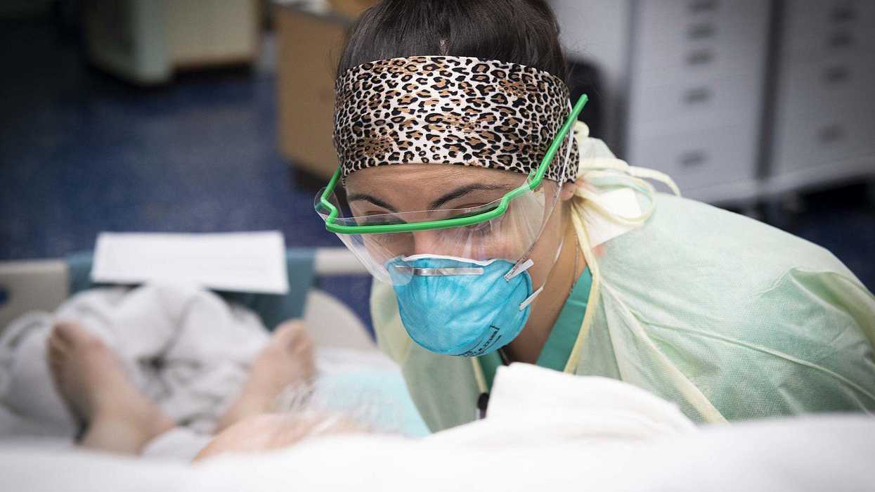 US Navy doctor with a COVID-19 patient in intensive care.