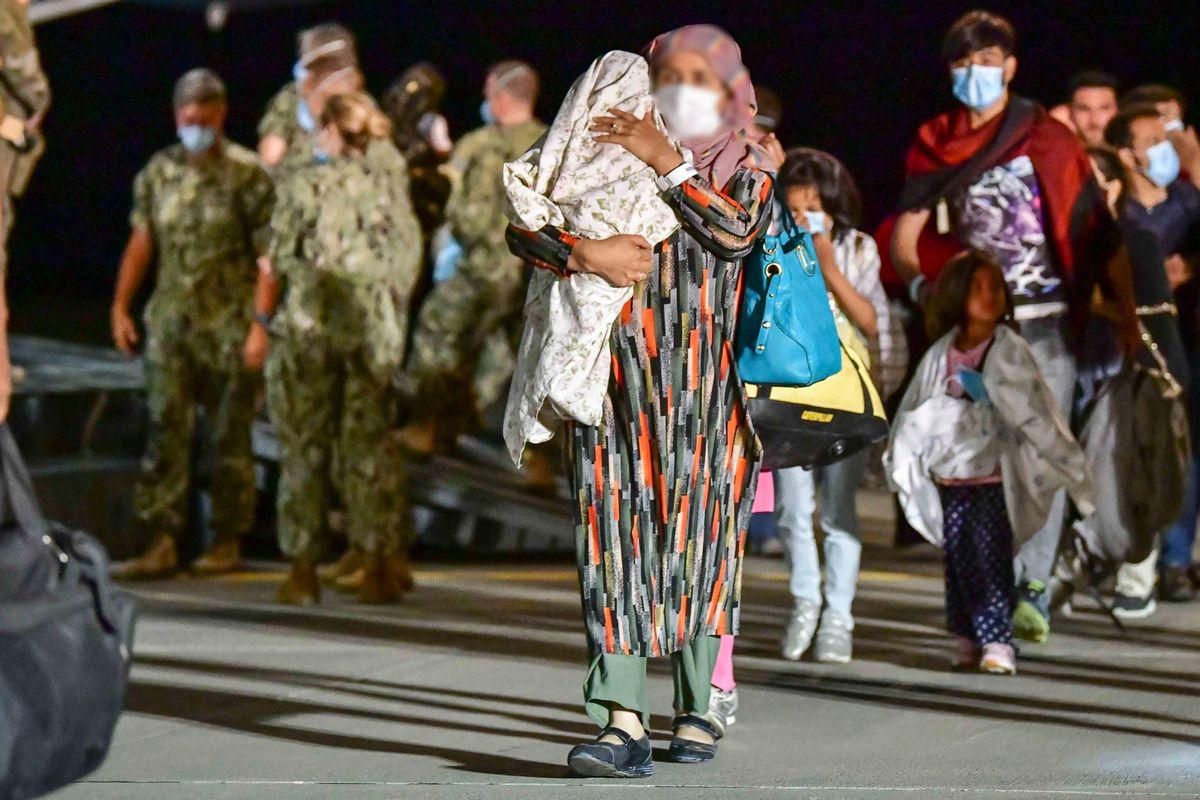 Afghan evacuees arriving at a US Military base. 