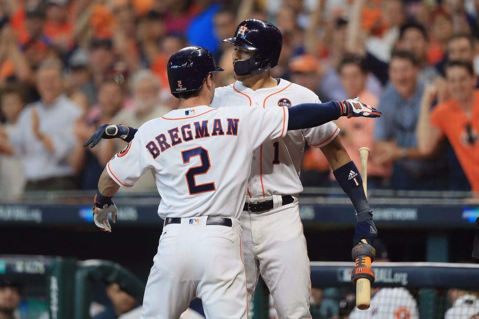 Alex Bregman and Carlos Correa celebrating in game one of the ALDS