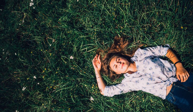 woman sleeping in the grass