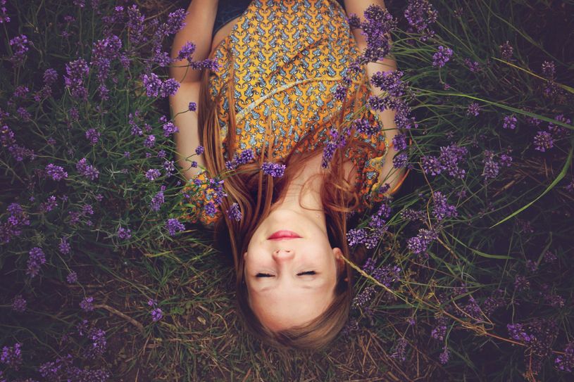 woman sleeping in the grass with lavender