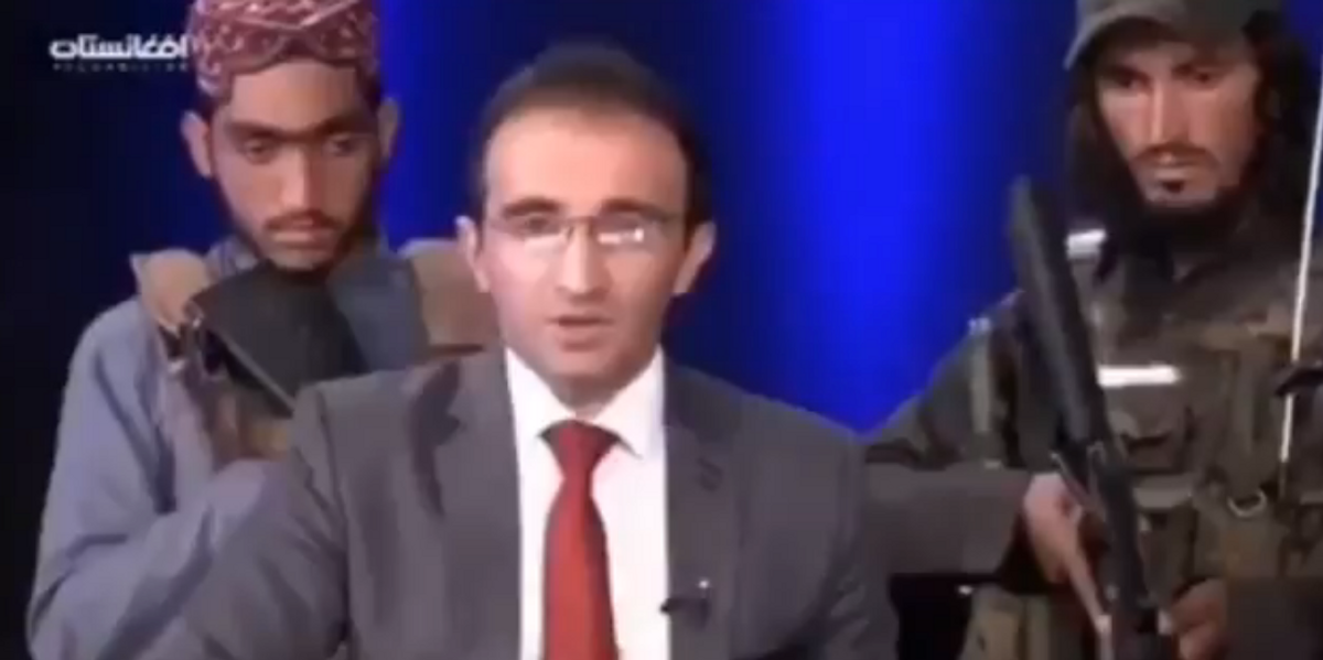 VIDEO: Afghan TV anchor tells residents 'don't be afraid' as Taliban fighters stand behind him with guns