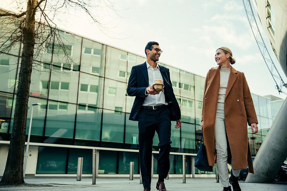 Man and woman take a walk at work