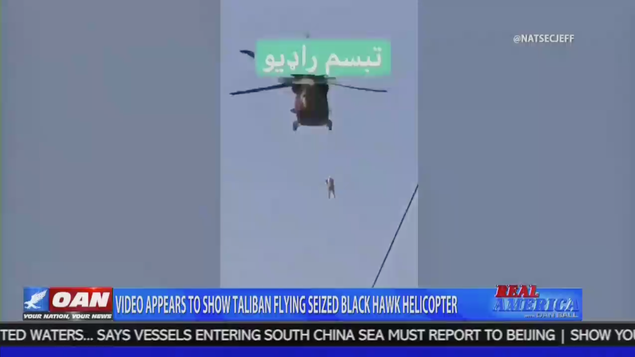 OAN displays debunked Afghanistan helicopter video.